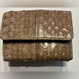 Judith Leiber EUC RARE mini wallet is crafted from genuine snake skin.